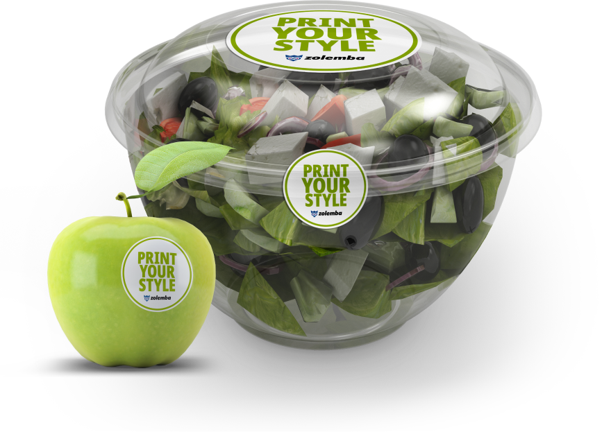 Contenant de salade en plastique avec un autocollant Zolemba 'Print Your Style' et une pomme verte portant le même autocollant.