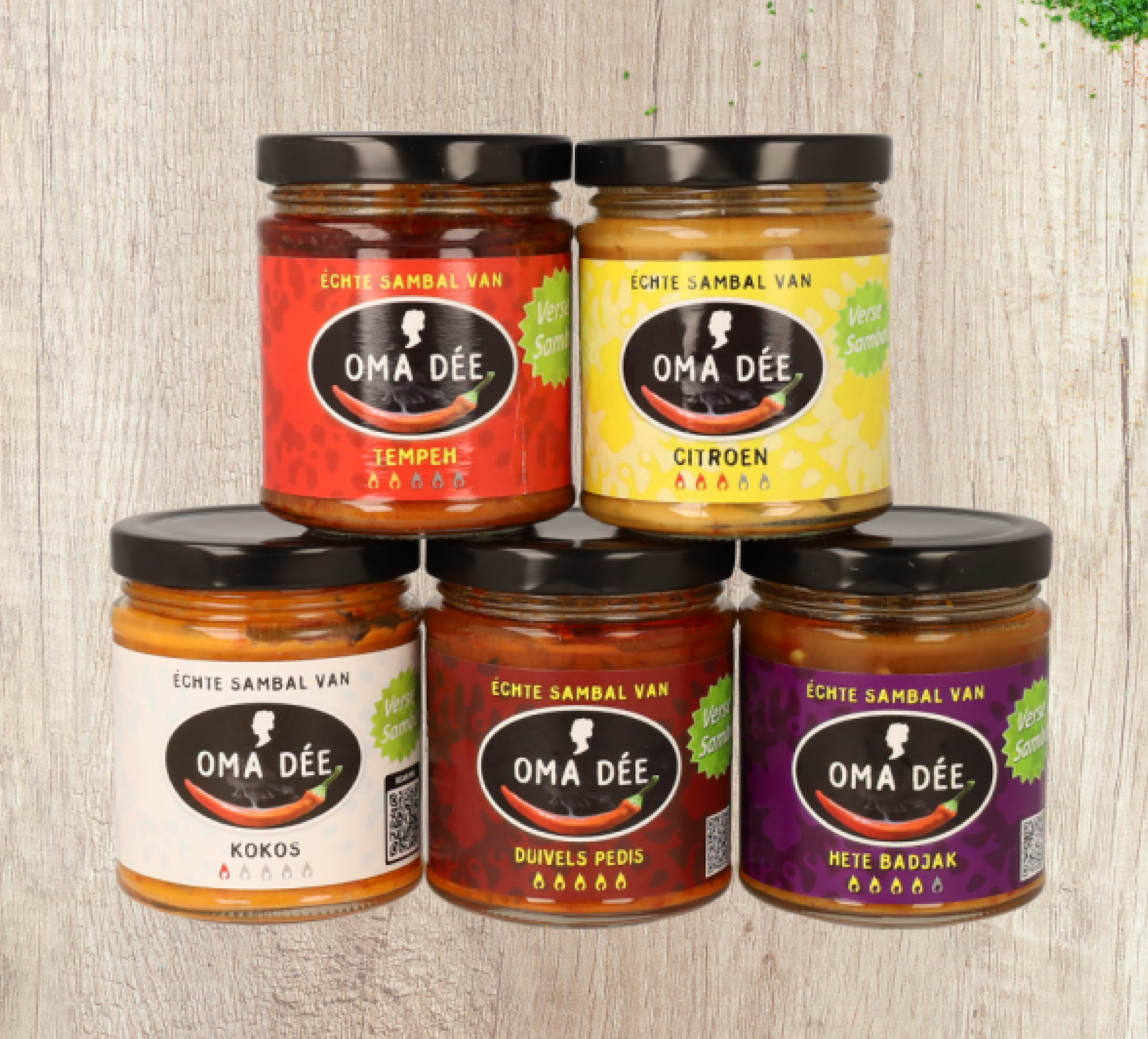 Five Oma Dee jars, three on the surface, two stacked, all branded.